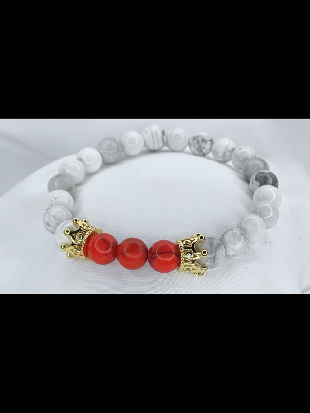 White Howlite Beaded Bracelet with Red Accent and Gold Crown Details